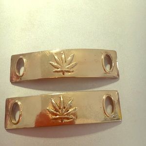 Pot leaf shoelace tags.